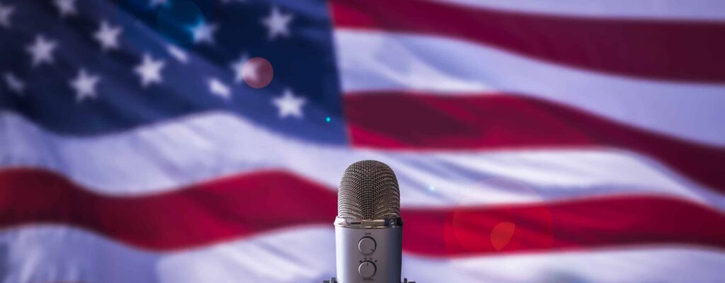 Microphone with American flag behind it