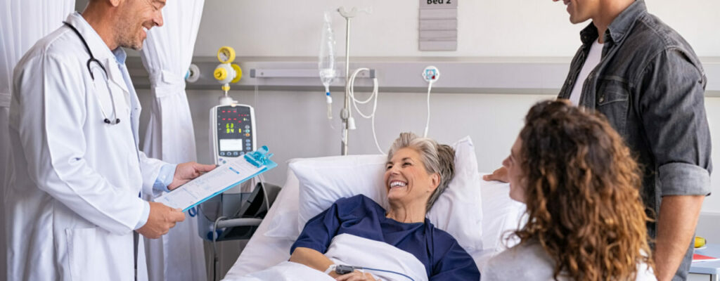 doctor taking care of hospital patient and communicating with family